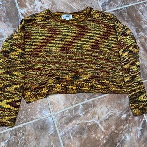 A cropped long sleeve sweater in a size XL.